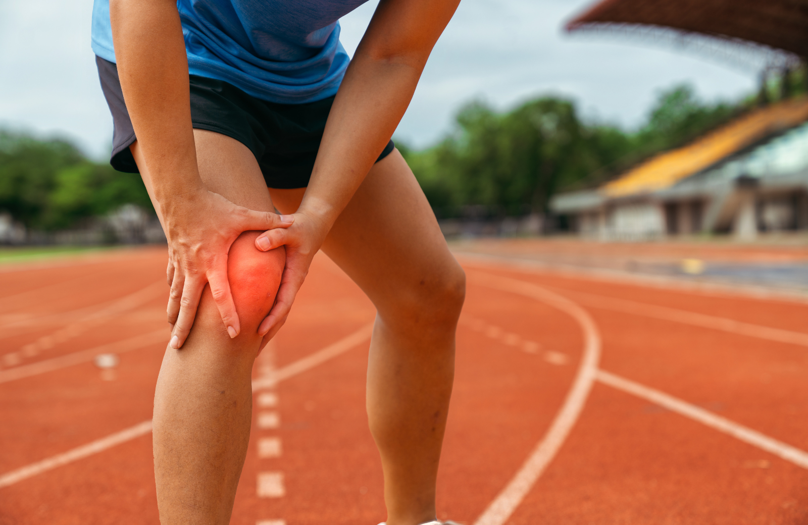 Athlete Holding Knee